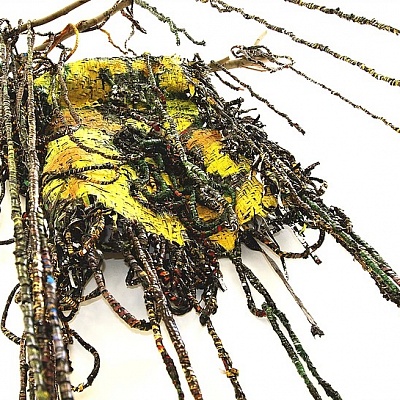 <em><strong>Liminal Incursion</strong></em>, 2015<br/> Woven strips of oil and gloss paint skins hung on a tree branch and falling to the floor, 300 x 120 cm