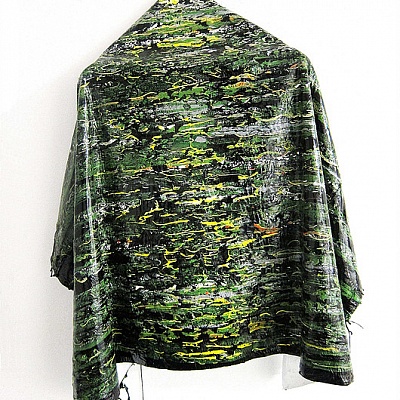 <em><strong>Water Lily Cape</strong></em>, 2015<br/> Oil and gloss paint skin cut - out formed into a cape and draped on a wooden hanger, 80 x 70 x 15cm approx