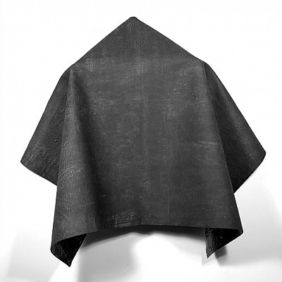<em><strong>Cape I</strong></em>, 2014<br/> Oil and gloss paint skin formed into a cape and draped on a wooden hanger, 70 x 70 x 15 cm