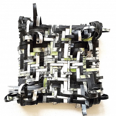 <em><strong>Ignacio</strong></em>, Oil and gloss paint skin cut-outs woven and mounted on canvas<br/> 20 x 20 x 7 cm